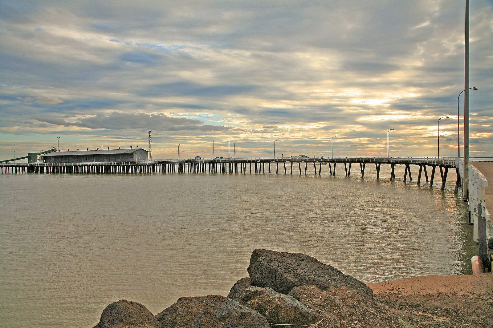 Derby jetty stretching out over the tidal flats of King Sound at sunset